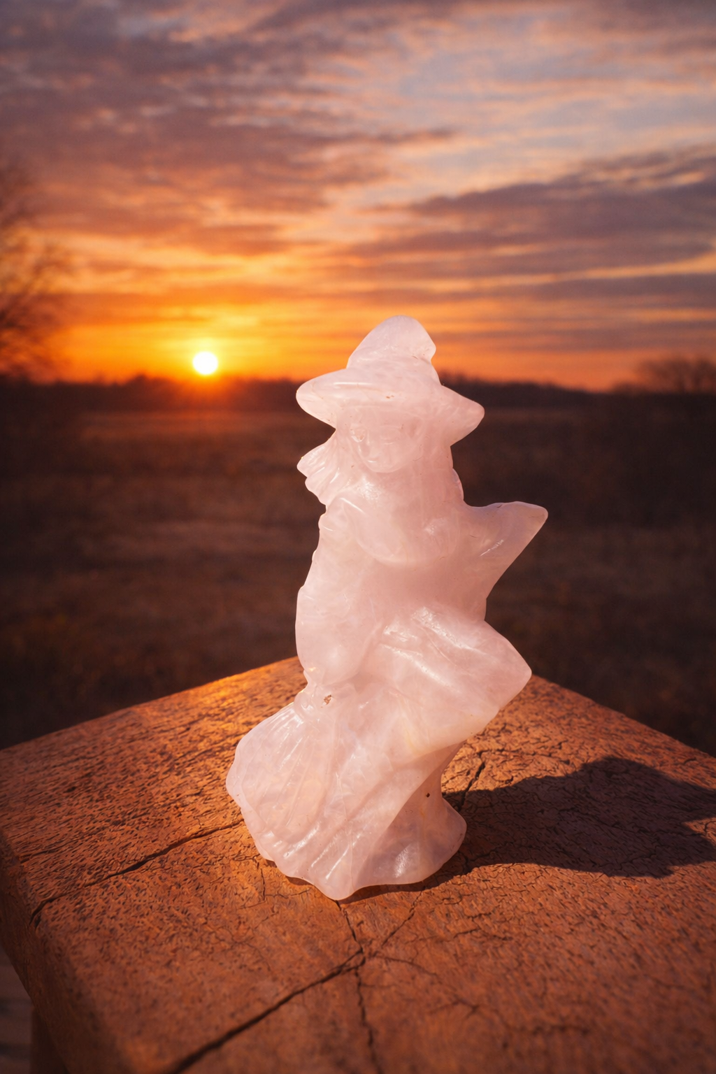 Pink Calcite stone witch carving with detailed features, crafted by Practical Magic Store, showcasing a mystical, handcrafted sculpture.