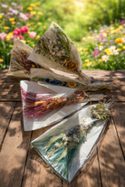 Springtime Besom Decor Brooms from Practical Magic Store featuring rustic wooden handles and woven broom heads for charming decor.