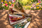 Springtime Besom Decor Brooms from Practical Magic Store featuring natural wood handles and decorative straw bristles.
