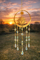 Sunshine and Growth Manifestation Suncatcher with colorful glass and decorative design, hanging in a sunny window.