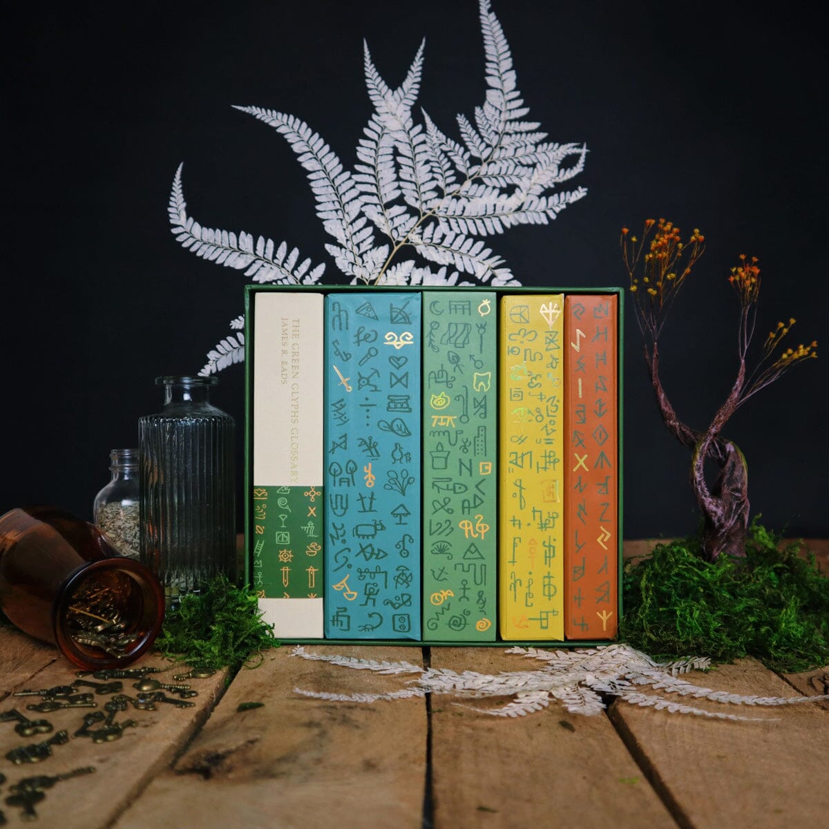 Prisma Visions Green Glyphs Box Set bundle featuring vibrant green glyph illustrations in a sleek packaging.