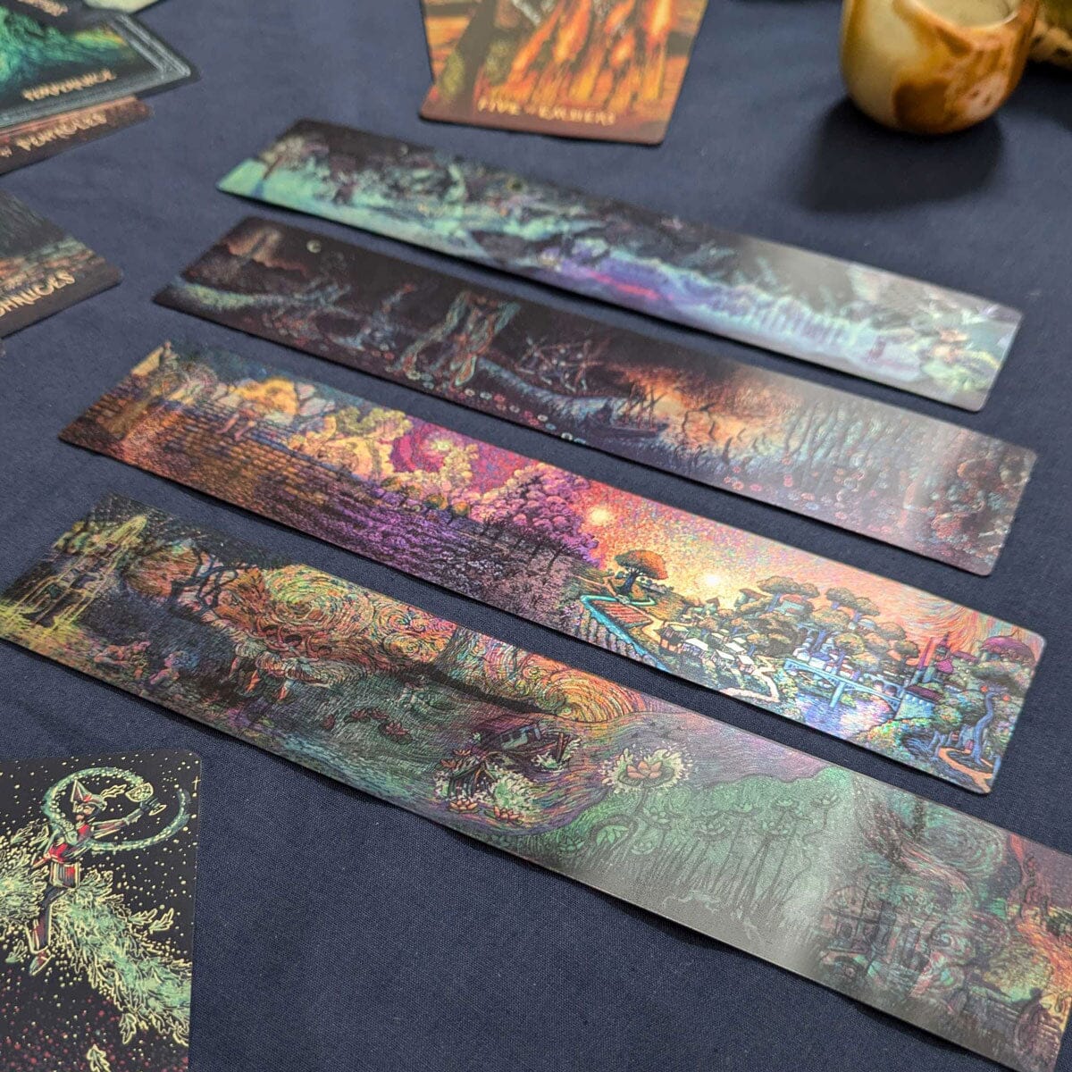 Set of four Prisma Visions Mirra Visions bookmarks featuring colorful, artistic designs for marking pages in books.