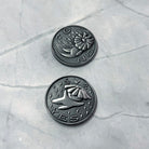 Prisma Visions Kuzo Yes/No coin with black and white design, featuring a stylized face and the yes/no options on a round coin.