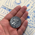 Prisma Visions Kuzo Yes/No coin featuring a distinctive design, used for decision-making or as a collectible coin.