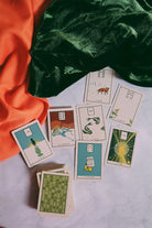 Green Glyphs Lenormand deck by Prisma Visions featuring mystical green-themed card illustrations for divination.
