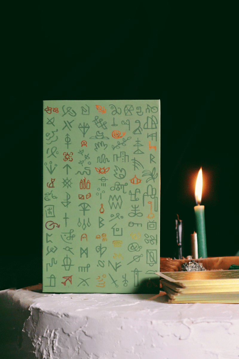 Green Glyphs Oracle deck by Prisma Visions featuring vibrant green and intricate glyph designs on the card backs.