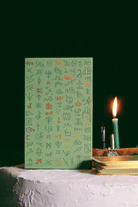 Green Glyphs Oracle deck by Prisma Visions featuring vibrant green and intricate glyph designs on the card backs.