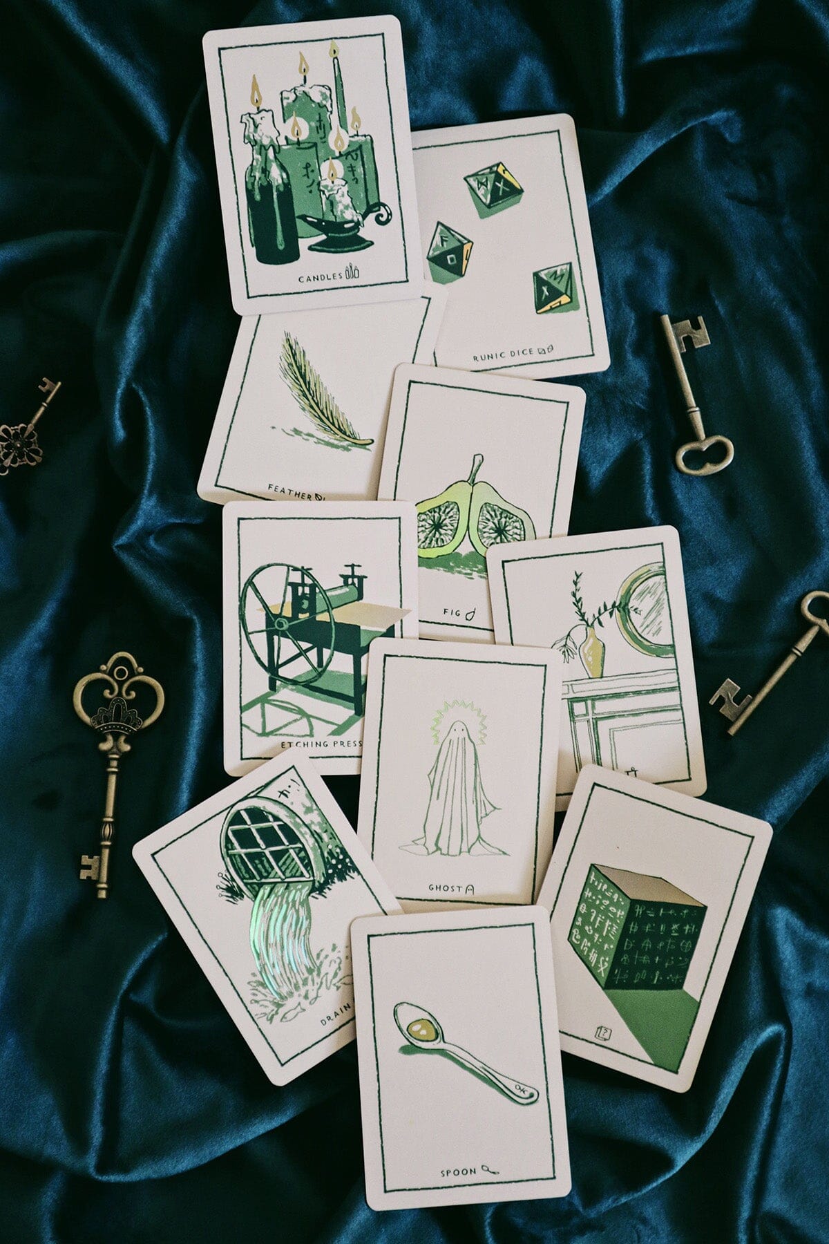 Green Glyphs Oracle deck by Prisma Visions featuring intricate green and black mystical glyph designs on card backs.