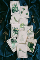 Green Glyphs Oracle deck by Prisma Visions featuring intricate green and black mystical glyph designs on card backs.