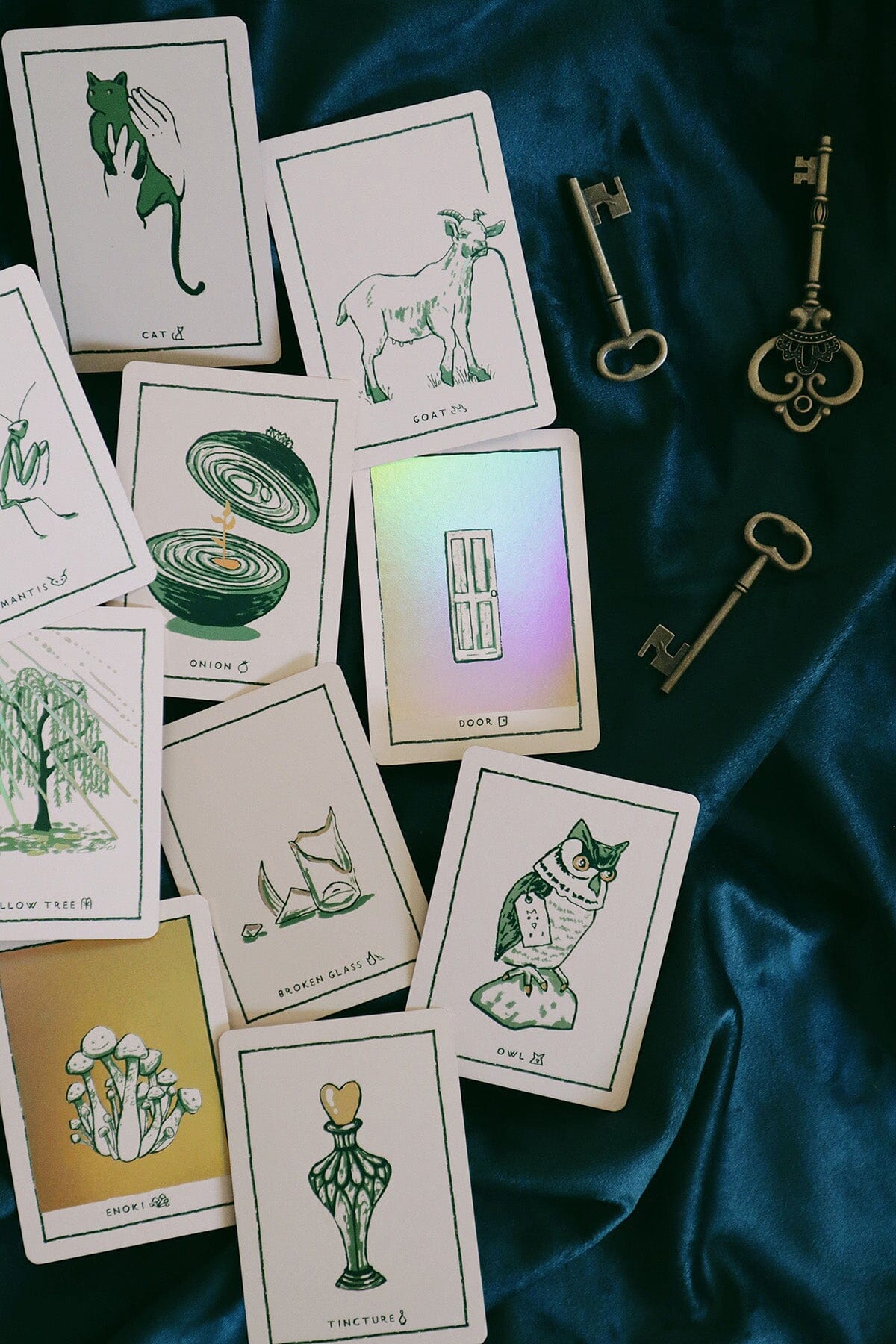 Green Glyphs Oracle deck by Prisma Visions featuring mystical green and gold card designs with intricate symbols and artwork.