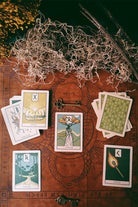 Prisma Visions Green Glyphs Runes deck featuring a set of mystical rune cards with green and gold designs on dark backgrounds.