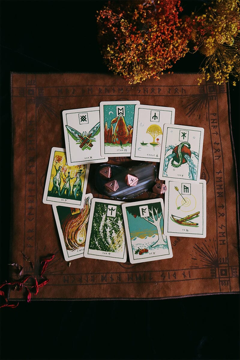 Green Glyphs Runes deck by Prisma Visions featuring intricate mystical symbols on card illustrations.
