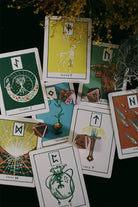 Deck of Green Glyphs Runes by Prisma Visions, featuring mystical rune symbols in a vibrant green design.
