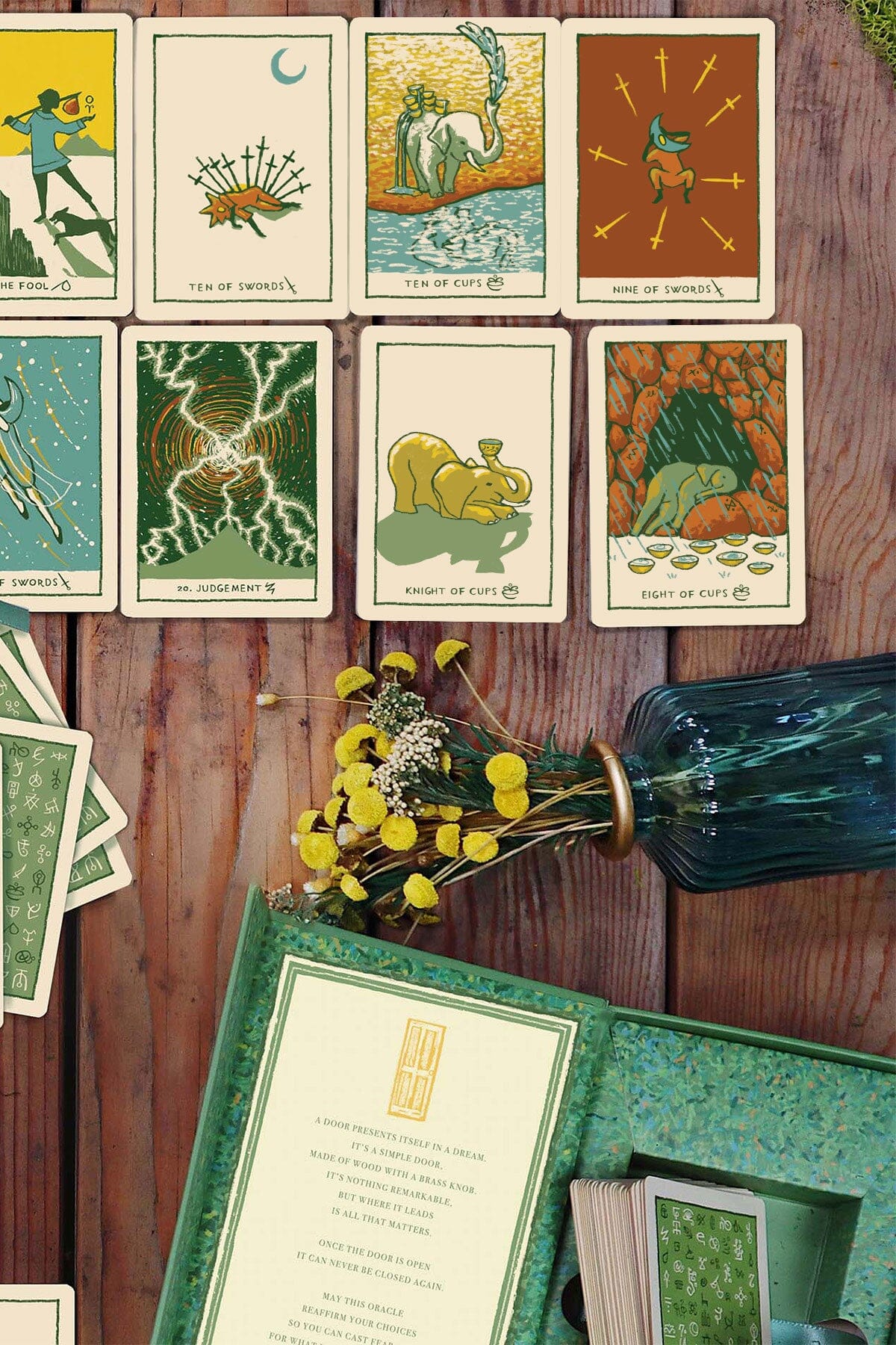 Green Glyphs Tarot deck by Prisma Visions featuring intricate green and black illustrated cards with mystical symbols.