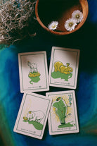 Green Glyphs Tarot deck by Prisma Visions featuring intricate green and black card designs on a dark background.