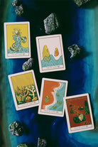 Green Glyphs Tarot deck by Prisma Visions featuring intricate green-themed tarot card designs on a dark background.
