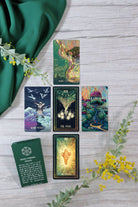 Little Cosma Visions tarot deck by Prisma Visions, featuring colorful, artistic card designs on a sleek box.