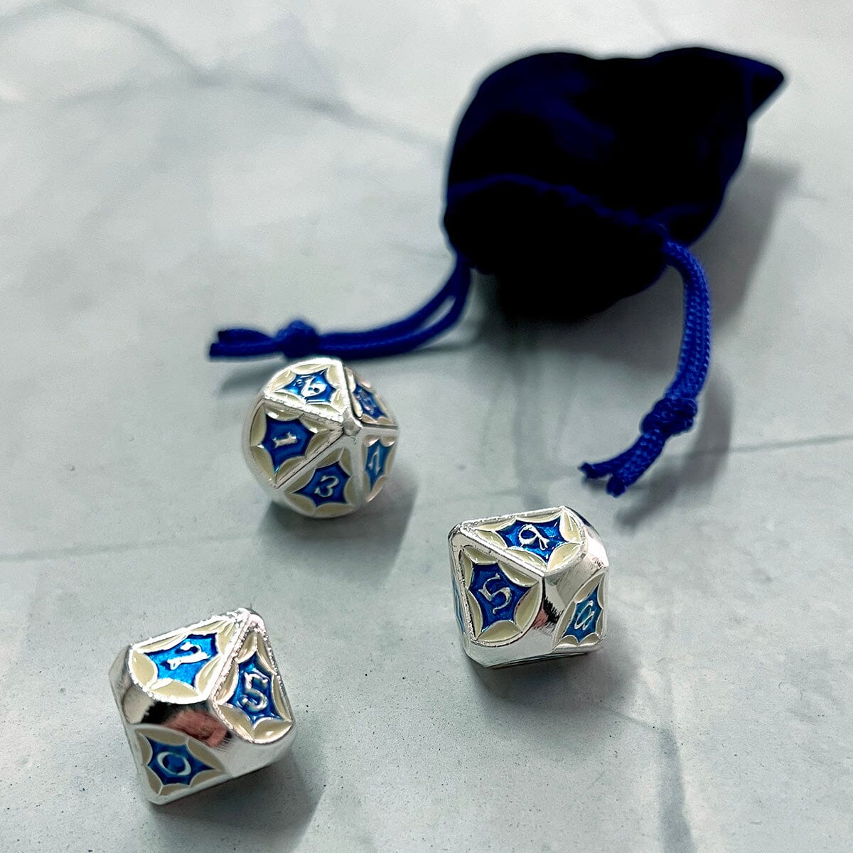 Cerulean Prisma Visions dice set featuring vibrant blue resin dice with intricate patterns and numbering for tabletop gaming.