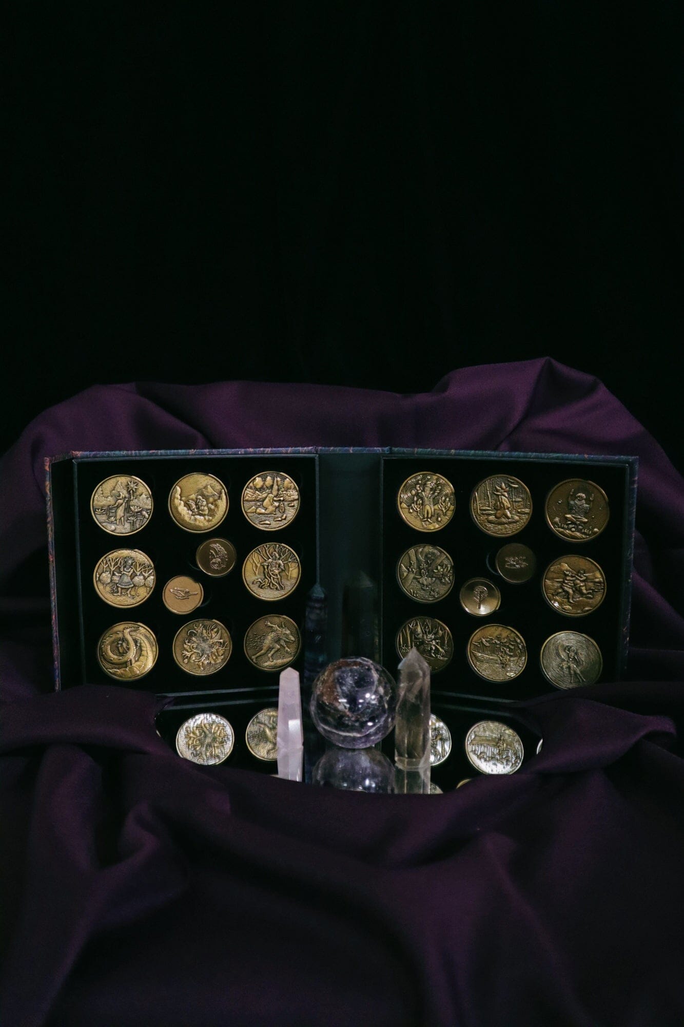 Set of 20 Prisma Visions geomancy coins with intricate symbols, used for divination and spiritual practices.
