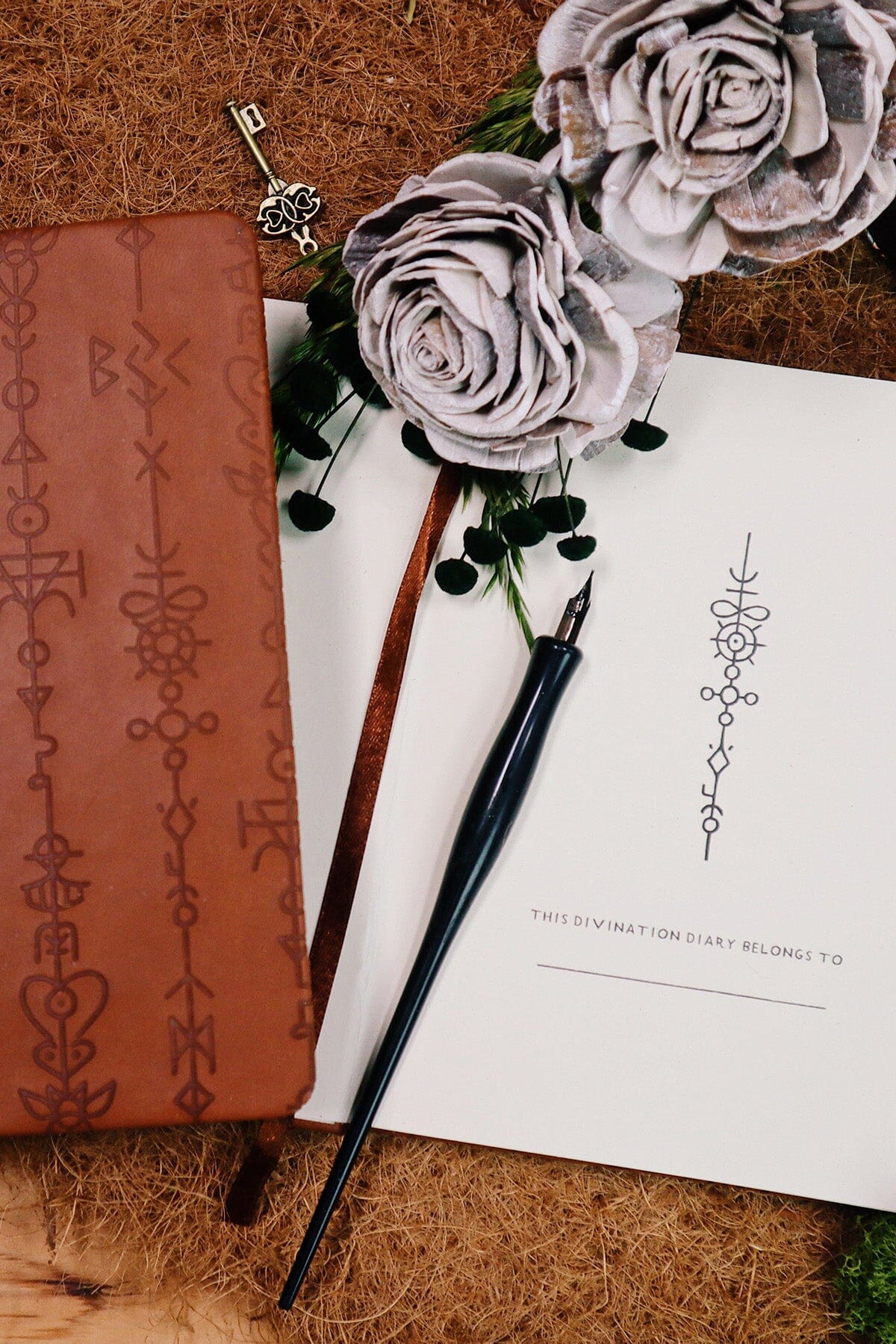 Green Glyphs Divination Diary journal by Prisma Visions with mystical glyph cover design and lined pages for daily reflections.