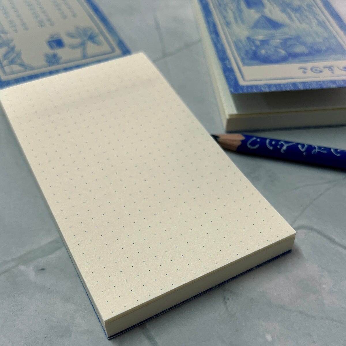 Cerulean Prisma Visions Notepad with blue cover and lined pages, ideal for journaling or note-taking.