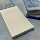 Cerulean Prisma Visions Notepad with blue cover and lined pages, ideal for journaling or note-taking.