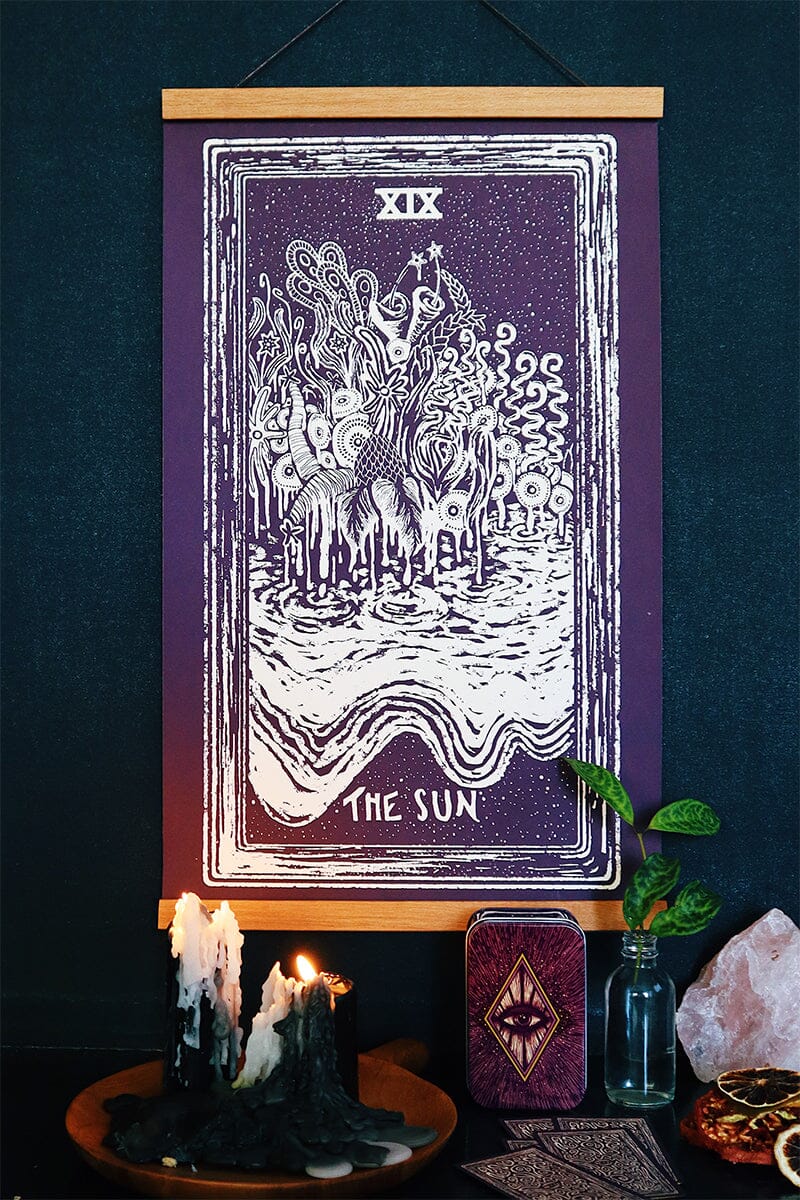 Cream-colored Prisma Visions tarot print of The Sun, 12x20 inches, featuring vibrant light and celestial imagery.