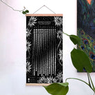 White print of the Moonflowers 2026 Lunar Calendar by Prisma Visions, featuring detailed lunar illustrations on paper.