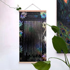 White print of the Moonflowers 2026 Lunar Calendar by Prisma Visions, featuring moon phases and celestial illustrations on paper.