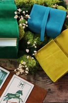 Prisma Visions Green Glyphs Satchel featuring a vibrant blue and green tarot-inspired design and adjustable shoulder strap.