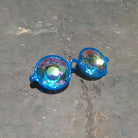 Cerulean spectacles by Prisma Visions with clear frames and blue-tinted lenses, displayed on a white background.