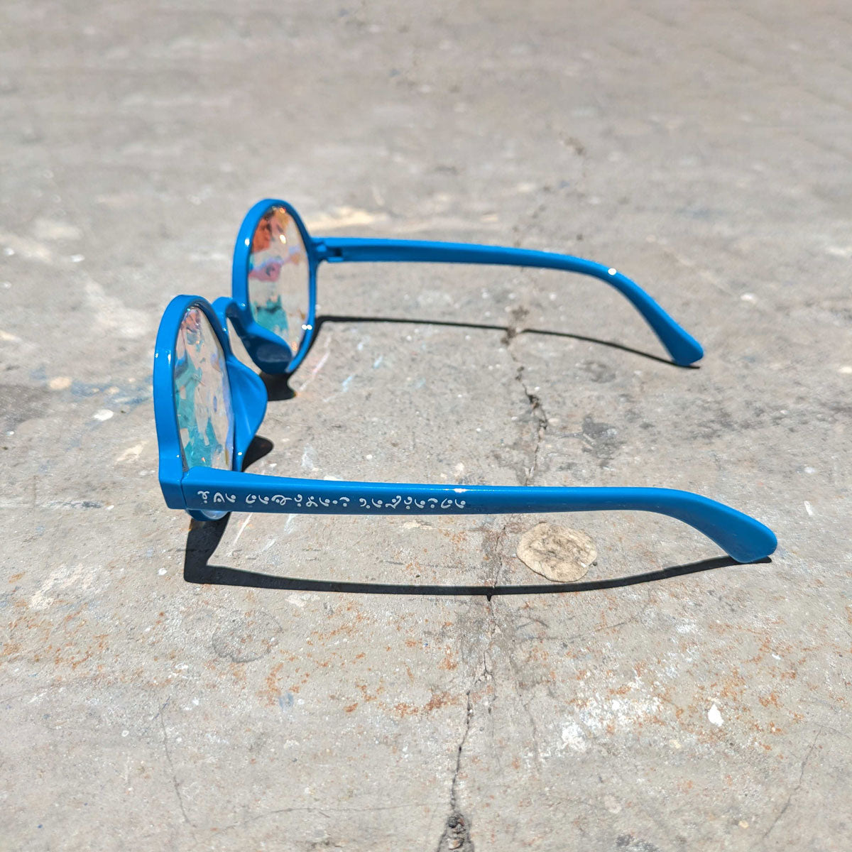 Cerulean spectacles by Prisma Visions featuring vibrant blue frames and clear lenses, stylish eyewear for everyday wear.