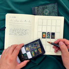 Prisma Visions Tarot sticker book featuring colorful tarot-themed sticker sheets and artwork for creative projects.
