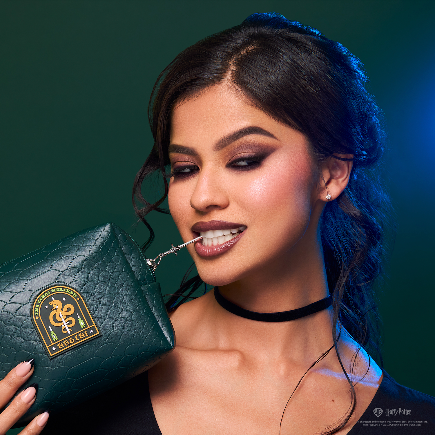 HP Dark Arts Nagini cosmetic bag by Profusion Cosmetics featuring face gems and a temporary tattoo accessory.