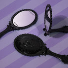 Profusion Cosmetics Not A Phase handheld mirror, a stylish accessories item with a sleek reflective surface.