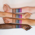 Wanderlust eyeshadow palette by Profusion Cosmetics with colorful shimmery and matte shades in a sleek compact.