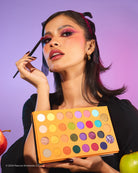 Profusion Cosmetics Peanuts Halloween Trick or Treat 31-shade eye palette with colorful eyeshadows and themed packaging.