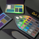 Profusion Cosmetics Enchanted Forest Divine Palette eyeshadow palette with vibrant green, brown, and shimmer shades for eye makeup.