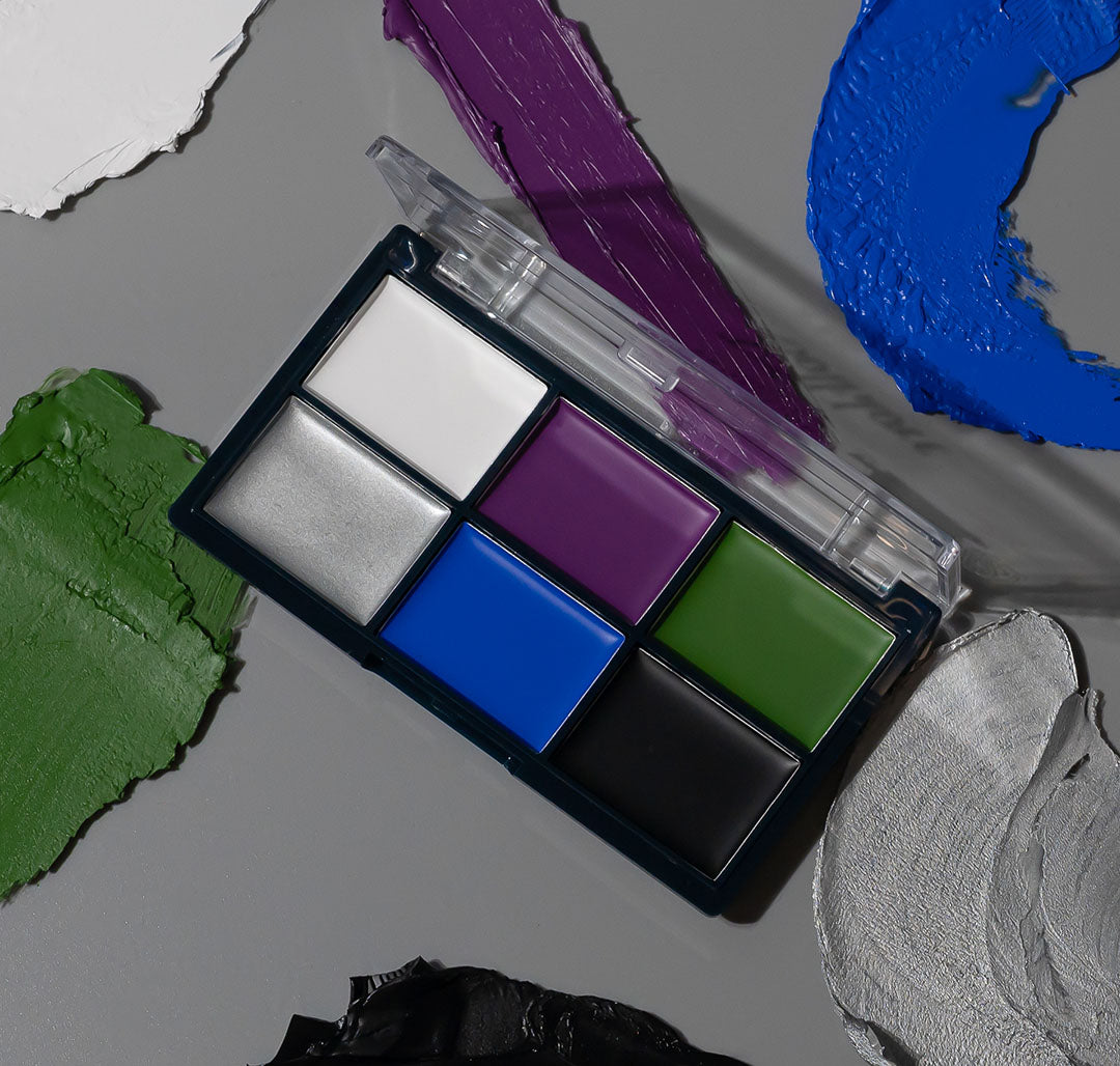 Profusion Cosmetics Enchanted Forest folklore face and body paint on eyes, featuring vibrant green and earthy tones for artistic makeup.