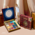 Harry Potter Holiday Hogwarts™ 16 Shade Eyeshadow Palette by Profusion Cosmetics with magical-themed colors and packaging.