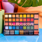 Profusion Cosmetics eyeshadow kaleidoscope with colorful, intricate eye makeup design featuring vibrant shades and artistic patterns.