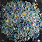 Profusion Cosmetics Metachrome Glitter Glitch Holo Brow Gel and Gems for eye makeup with shimmering, holographic effects.