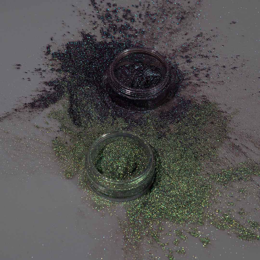 Profusion Cosmetics Enchanted Forest Dragon duochrome mineral eyeshadow pigment with shimmering green and purple hues on eyes.