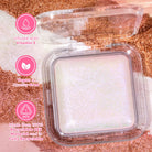 Profusion Cosmetics Holo Beam holographic highlighter on face, showing its shimmering, iridescent finish for a radiant glow.