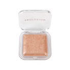 Profusion Cosmetics Holo Beam holographic highlighter on face, showing its shimmering, radiant glow for luminous skin.