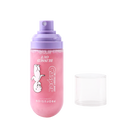 Profusion Cosmetics Blissed Out Illuminating Setting Spray on a face, showcasing a refreshing and luminous finish.