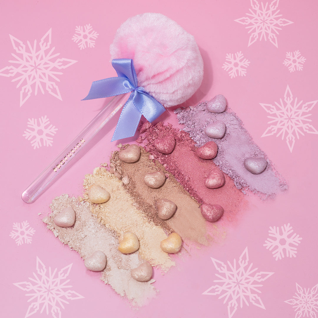 Profusion Cosmetics Frosted Snow Sparkle face powder puff set with shimmering, twinkling lights design for a radiant makeup look.