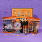 Profusion Cosmetics Peanuts Halloween Magical Wizard Chrome Liquid Topper set on face with colorful, shimmering makeup for festive looks.