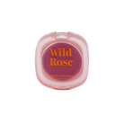 Profusion Cosmetics Petal Perfect Wild Rose lip and cheek cream blush on face, shows natural pink color and smooth texture.