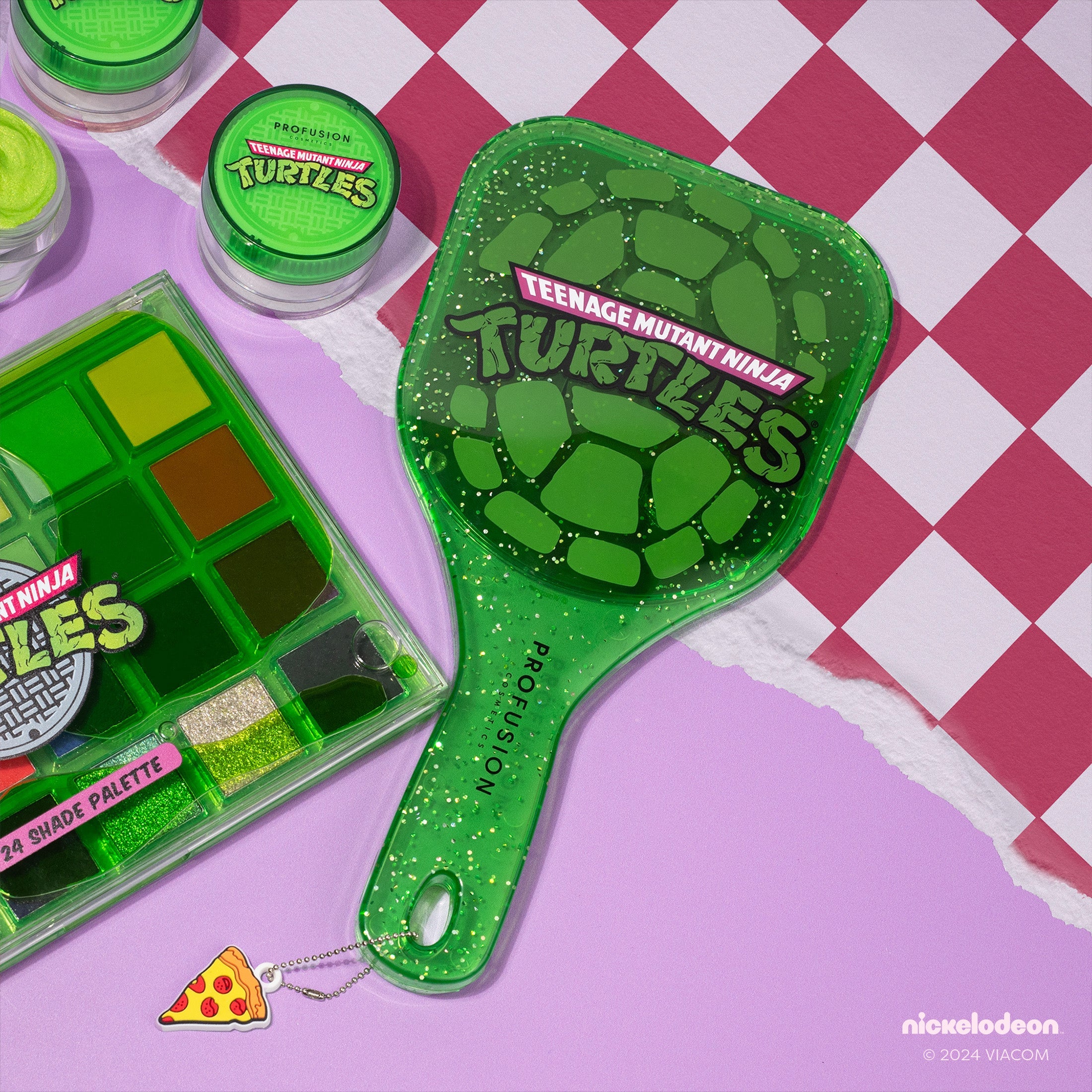 Profusion Cosmetics TMNT face handheld mirror showing a detailed face design in a sleek, portable mirror style.
